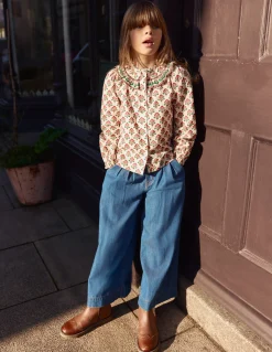 Blouse à empiècement volanté
