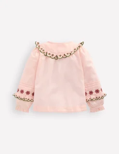 Blouse à empiècement volanté