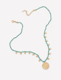 Collier court à rangées de perles