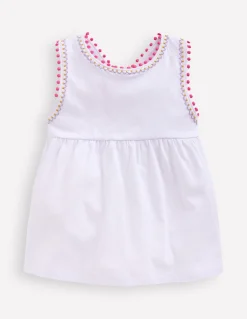 Top à dos croisé détail pompons