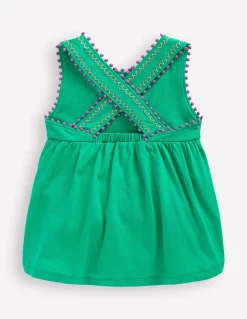 Top à dos croisé détail pompons