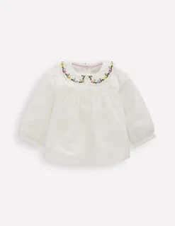 Top tissé à col brodé